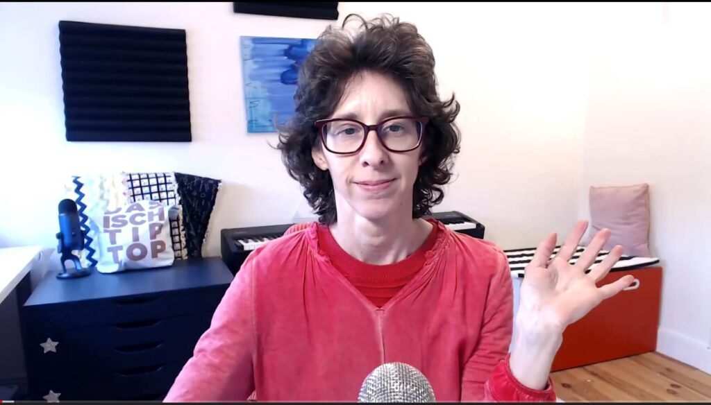 Lihi of Creative Express Studio preparing for a 3 minute creative writing exercise.